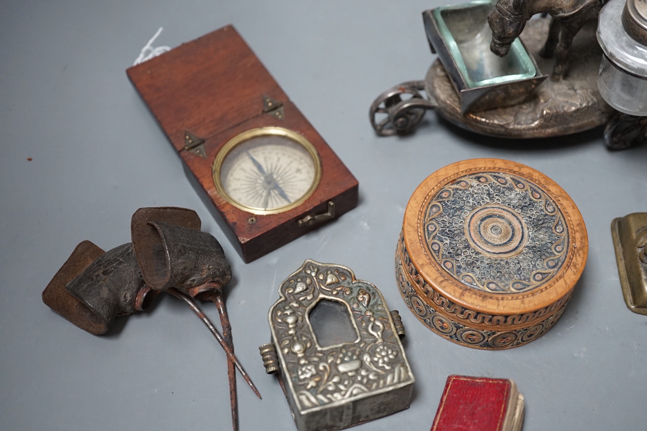 A selection of various miscellaneous items, to include a pair of 19th century cock fighting spurs, a rolled paperwork circular box and cover, a novelty plated donkey cruet, Tibetan box etc.